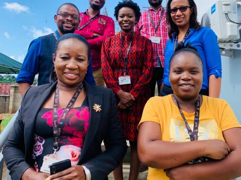 Community-Engagement-and-Bioethics-Associate-Research-Group-lead-Deborah-Nyirenda-in-blue-shirt-with-her-team-members.-Credit-Hendrina-Nkuta-e1648199962781